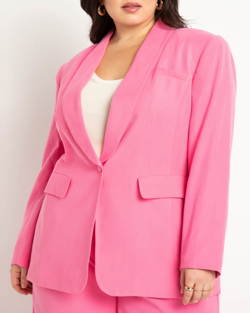 Side of a model wearing a size 24 Shawl Collar Blazer in Pink Power by ELOQUII. | dia_product_style_image_id:273569